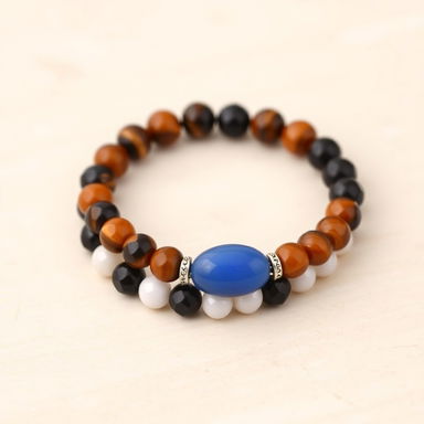 A beautifully crafted bracelet featuring a combination of 8mm beads made from tiger's eye, hematite, carnelian, white quartz, and black obsidian, perfectly alternating in a vibrant pattern