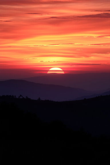 A beautiful sunset over a tranquil landscape, perfectly designed for a book cover