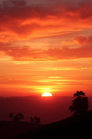 A beautiful sunset over a tranquil landscape, perfectly designed for a book cover