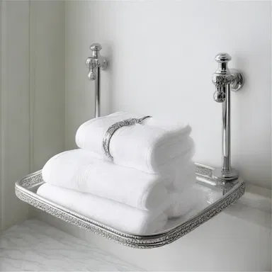The elegant bathroom design included a silver holder for the hand towels.