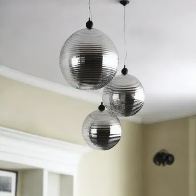 The interior designer suggested using screw eyes to hang lightweight decorations from the ceiling.