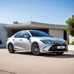 A silver Toyota Xli car with a custom 'BOY' number plate. The car is parked against a clear, sunny day backdrop.