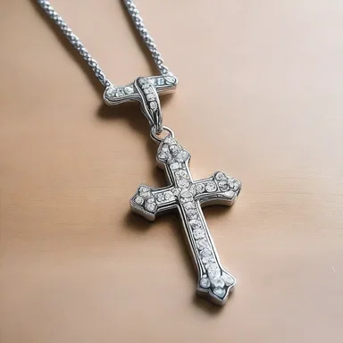 The crystallized cross hanging from the necklace symbolizes purity and divinity.