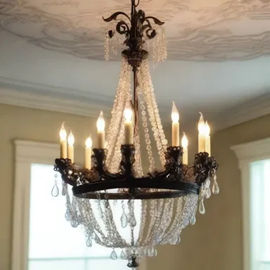 The ornate chandelier hanging ingratiatingly from the ceiling added a touch of elegance to the room.