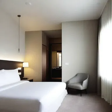 The sleek, modern design of the room had a numbing effect, creating a sense of minimalism.
