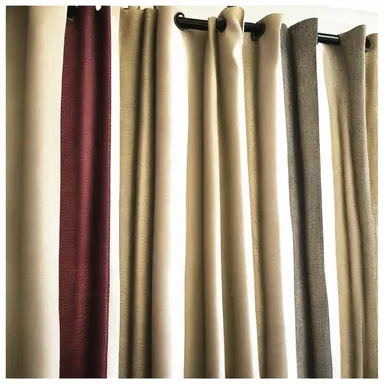 The interior designer sorted through different fabric samples to choose the most appropriate one for the drapes.
