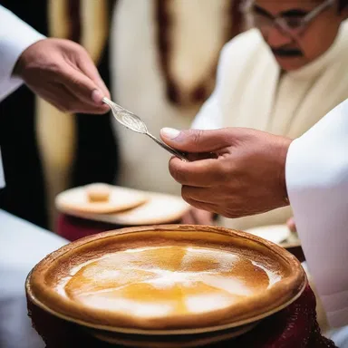 During the religious ceremony, the priest used a silver sugar spoon to sprinkle sugar over the holy bread.